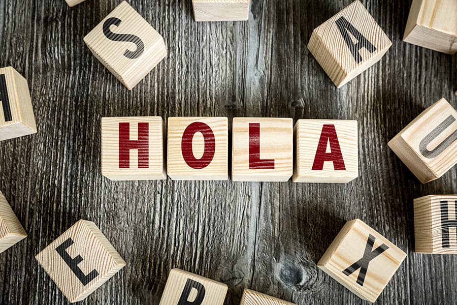 "Hola" spelled out in child's letter blocks